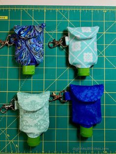 four small pouches are on a cutting board with a green ruler and blue background