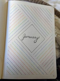 an open notebook with the word january written on it