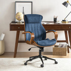 a blue office chair sitting on top of a wooden desk next to a white rug