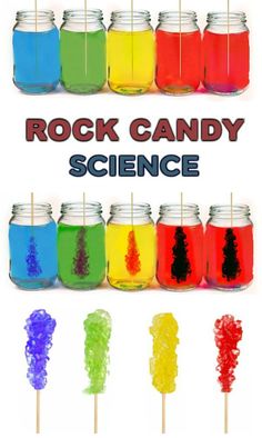 some jars filled with different colored liquids and candy lollipop skewers