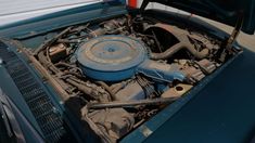 the engine compartment of an old blue car