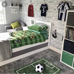 a soccer themed bedroom with green and white decor