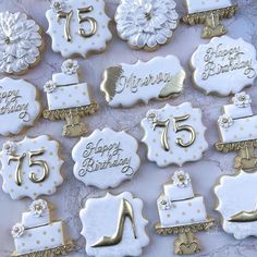 decorated cookies with white and gold frosting are arranged on a tablecloth that says, fifteen happy birthday