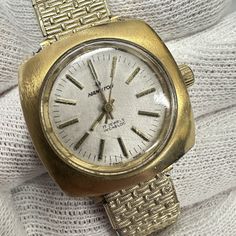 1960s Hamilton wristwatch features a gold-tone case with a Speidel bracelet and a stainless steel back. The dial features gold-tone hour marks with original gold-tone hands. Hamilton was founded in 1892 in Lancaster, Pennsylvania and began producing pocket watches. From the very beginning, the focus was on quality and accuracy, and these principles have made Hamilton the internationally renowned watch brand it is today. The movement is in great condition and keeps pretty good time Good condition Vintage Gold Analog Watch, Gold Vintage Analog Watches, Retro Gold Watches With Subdials, Gold Retro Watches With Subdials, Vintage Gold Watches With Metal Dial, Retro Gold Analog Watch Accessories, Vintage Gold Watch With Subdials, Vintage Gold Watches With Subdials, Gold Retro Watch With Round Dial