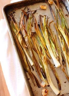 asparagus and other vegetables on a baking sheet