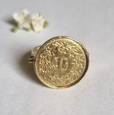 Signet ring women, gold coin ring, pinky ring, coin signet ring, coin pinky ring, coin pinky ring, silver coin ring, mens ring This lovely, silver coin ring was made of a Swiss Franc 10p coin, which was soldered to a wide handmade band decorated with silver granolites, creating a beautiful signet ring for women. The signet coin ring is available both in 14k gold plating over brass or silver and in solid sterling silver shiny or slightly oxidized (watch the short video to see). The ring is a grea Vintage Engraved Coin Signet Ring, Vintage Coin Signet Ring As Gift, Vintage Coin Signet Ring For Gift, Vintage Coin Shaped Signet Ring Gift, Gold Coin-shaped Engraved Signet Ring, Gold Engraved Coin Signet Ring, Elegant Engraved Coin Rings, Gold Coin-shaped Signet Ring For Gift, Gold Coin Shaped Signet Ring