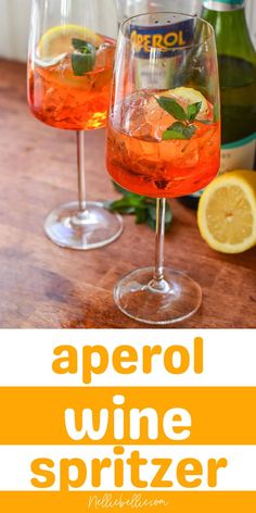 two glasses filled with aperol wine spritzer