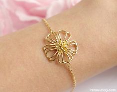 These are beautiful gold chain braceletMade of:- 14K gold plated brass chain;- gold plated brass daisy flower. The bracelet is adjustable, it's length is 14,5 cm and extends to 19 cm.If you have any questions please send a message and I will be happy to answer you!••• Comes in a gift box at no extra cost, ready for gift giving! •••••• The shipping costs INCLUDE international registered mail and insurance •••==============================================================Daisy flower bracelet, Adju Delicate Gold Chain Bracelet For Gift, Delicate Gold Chain Bracelet As Gift, Delicate Gold Plated Bracelet For Gift, Delicate Gold-plated Bracelet For Gift, Delicate Gold-plated Bracelet As Gift, Delicate Gold Plated Chain Bracelet As Gift, Delicate Yellow Gold Flower Bracelet, Dainty Yellow Gold Bracelet With Flower Charm, Dainty Flower Bracelets With Adjustable Chain