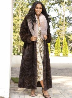 Wrap yourself in this beautiful, full-length sectioned Mink Fur coat. The full fox fur collar adds an extra touch of elegance, which is why this fabulous coat is a top seller! This style is sometimes custom-made, please allow approximately 2-3 weeks for delivery. For questions or rush orders, please use our chat or call 334-277-7610. Length: 52 inches Fur Origin - United States/Norway/Canada Dye added Don't see your size or color? Please call to see if we can custom make it for you SKU: 193112 Luxury Long Fur Coat, Luxury Long Fur Coat For Fall, Elegant Long Mink Outerwear, Luxury Mink Color Long Fur Coat, Long Mink Color Fur Coat With Faux Fur Trim, Luxury Fur Coat With Feather Trim, Luxury Long Coat With Faux Fur Trim, Mink Fur Coat, Mink Fur