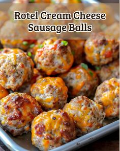 some cheese balls are in a pan with sauce on top and the words, hotel cream cheese sausage balls