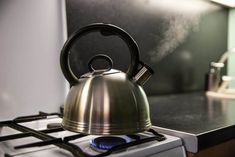 a tea kettle sitting on top of a stove