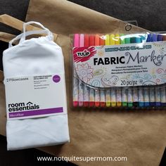 some markers and a bag on a table