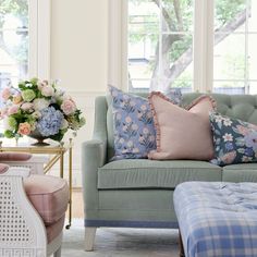 a living room filled with furniture and flowers