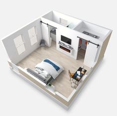 an overhead view of a bedroom and living room in a home with white walls, hardwood floors, and open concept floor plans