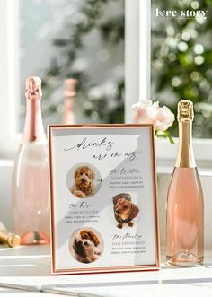 a bottle of champagne next to a sign with pictures of dogs on it and flowers in the background