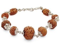 This is a Powerful and unique Rudraksha Navagraha Bracelet. The Navgrah Rudraksha Beads Bracelet consists of Rudraksha from 2 Mukhi to 9 mukhi and 12 Mukhi (1 Bead each). This Bracelet appeases all the negative planets and gives power to benefic planets. Navgarh Rudraksha Bracelet should definitely be worn by everyone. This is a Powerful and unique Rudraksha Navagraha Bracelet. The Navgrah Rudraksha Beads Bracelet consists of Rudraksha from 2 Mukhi to 9 mukhi and 12 Mukhi (1 Bead each). This Bracelet appeases all the negative planets and gives power to benefic planets. Navgarh Rudraksha Bracelet should definitely be worn by everyone. Navgrah Mala Rudraksha Beads do not have any negative effect. It would definitely give you benefits. Wearer of Navgrah Rudraksha Mala - Rosary is blessed with