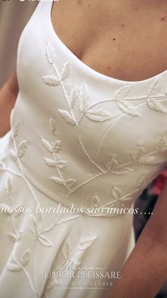 the back of a woman's wedding dress with white flowers on it and text that reads, princess bridals san francisco