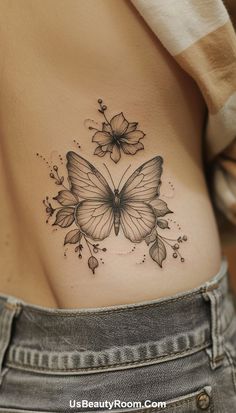 A stunning butterfly and floral ribcage tattoo with intricate details, capturing the elegance and grace of nature. This small tattoo is ideal for girls looking for a feminine and artistic design on their ribcage. Ribcage Tattoo Ideas, Small Ribcage Tattoo, Small Hip Tattoo Ideas, Small Hip Tattoo, Hip Tattoos For Girls, Hip Tattoo Ideas, Beautiful Back Tattoos, Side Hip Tattoos, Single Rose Tattoos