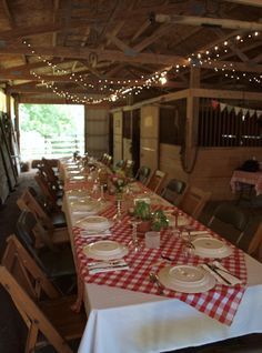 an image of a dining room set up for a party with red and white checkered tablecloths