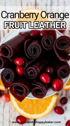 cranberry orange fruit leather in a white bowl on top of an orange slice