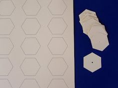 two pieces of white paper next to each other on a blue background with hexagonal shapes