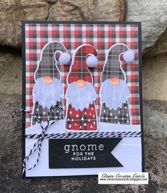 a card with three gnomes on it and the words gnome's holiday written in white