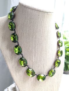 "Lovely green olivine oval stones are like a ring of crystallized mossy green forest around your neck. Each stone hand set and hand linked with high quality findings. Made to last a lifetime. Adjustable from 16 to 18\" with lobster claw and extender. stones are 18x13mm Beautiful for layering. Inspired by georgian collets. Gift boxed Find more to layer here : Www.sacredcake.etsy.com" Bridgerton Ball, Ruby Kyanite, Necklace Art Deco, Mossy Green, Necklace Art, Anna Wintour, Green Jewelry, Art Deco Necklace, Vert Olive