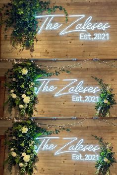 two wooden boards with white flowers and greenery on them, along with the words the zeffert est 2012