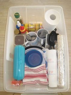 a plastic container filled with lots of clutter