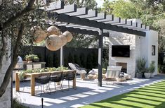 an outdoor dining area with chairs and tables