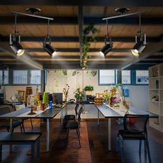 an office with several desks and chairs in it