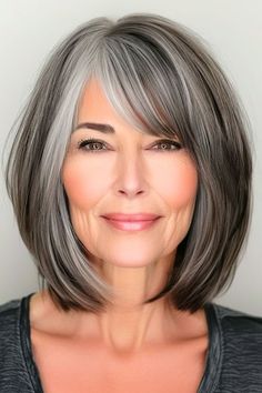 Save this pin for the best gray bob hairstyles for older women. Embrace the natural transition to gray with this stunning salt-and-pepper long bob. The mix of dark and light tones creates a striking multidimensional look. Dark Salt And Pepper Hair, Salt Pepper Hair Going Gray, Salt And Pepper Hair Bob, Low Lights For Gray Hair Short, Salt And Pepper Hair With Bangs, Salt And Pepper Hair Over 50, Gray Bob With Bangs, Dark Hair With Gray Highlights, Short Salt And Pepper Hair