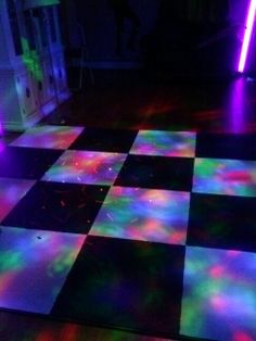 a checkered floor with colorful lights on it