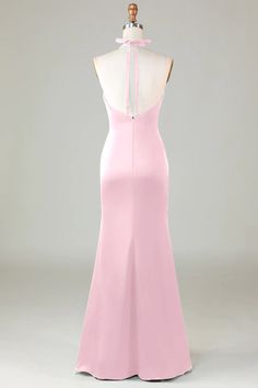 the back of a pink dress with a bow on it's neck and shoulders