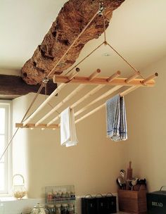 clothes hanging from a rope in a bedroom