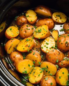 cooked potatoes with herbs in a slow cooker