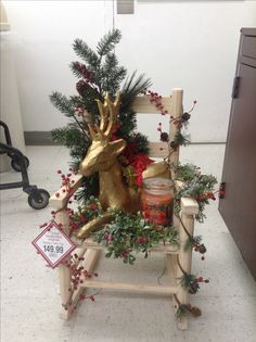 a wooden rocking chair decorated with christmas decorations