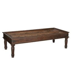 an old coffee table with wooden legs and wood grained top, on white background