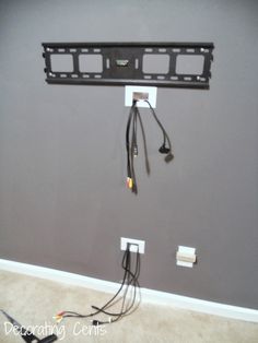 the wall mounted tv is connected to two wires