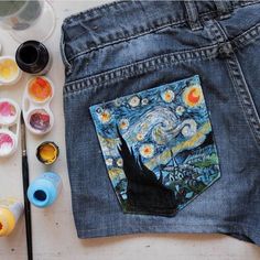 an image of the starry night in someone's jeans with paint and brushes