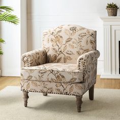 a chair sitting on top of a rug next to a fireplace