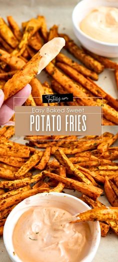 a person dipping some potato fries into a small white bowl with dip in it and the text overlay reads easy baked sweet potato fries