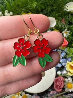 "Red flower earrings with green leaves and golden details. *Length (using default ear hooks): 1.75\"  *Weight (approx, each): 2g ✨Upgradable earring options available are: Gauge sizes are approximate, batches may vary. Some options may be in limited supply and may take additional time to ship.  *304 Steel mini hooks, silver color, 22 gauge (0.7mm). This is the perfect option for anyone with smaller lobes or with low piercings.  *316L Steel hooks, silver color, 21 gauge (0.8mm).  *Golden steel ho Red Flower Drop Earrings, Red Flower Charm Earrings, Red Drop Earrings With Flower Charm, Red Flower Earrings With Ear Wire, Red Flower Earrings With Ear Wire For Gift, Red Dangle Earrings With Flower Charm, Red Earrings With Flower Charm For Gift, Red Flower Shaped Earrings With Ear Wire, Red Flower-shaped Earrings With Ear Wire