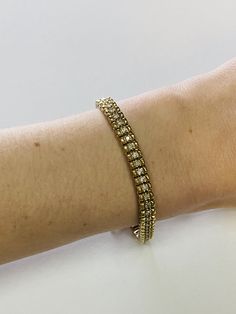 "This is an elegant 14K yellow gold and diamond tennis bracelet. Material(s): 14K yellow gold + (60) diamonds 0.03 points each (Total diamond weight: 2 carats) Weight: 21.1 grams Flaws (if any): None to mention Marking(s): \"14K\" Inside of bracelet measures 7 inches and 5.3 millimeters. If you have any questions about this diamond tennis bracelet, please do not hesitate to contact us! ♥" Gold Tennis Bracelet With Single Cut Diamonds For Wedding, Classic Gold Tennis Bracelet, Brilliant Cut, Classic Gold Tennis Bracelet With Brilliant Cut, Timeless Hand Set Yellow Gold Tennis Bracelet, Yellow Gold Tennis Bracelet With Diamond Accents For Anniversary, Gold Tennis Bracelet With Diamond Accents, Gold Diamond Bracelet For Anniversary, Anniversary Yellow Gold Tennis Bracelet With Diamond Accents, Classic Gold Tennis Bracelet With Diamond Accents