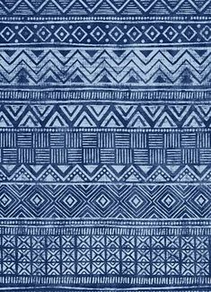 a blue and white rug with different patterns