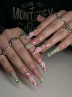 #greennaildesigns #sagegreen #summernails #greennailsideas #pinkaura Nail Ideas Acrylic Sage Green, Nail Idea Long Square, Sage Green Fairy Nails, Planet Charm Nails Design, Quinceanera Nails Sage Green, Pink And Green Nails Design Color Combos, Nails With Butterflies And Flowers, Green With Pink Nails, Summer Nails Sage Green