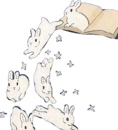 an open book with rabbits flying around it