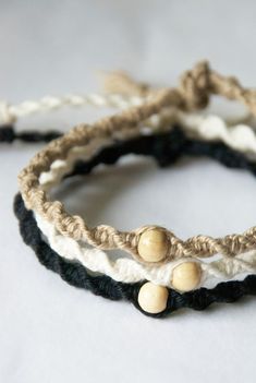 three bracelets with wooden beads on them