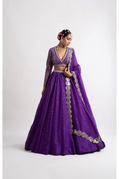 Intricately hand embroidered v neck blouse clubbed with a silk organza lehenga and a hand cut mirror border dupatta. FABRIC USED Lehanga - Organza Dupatta - Organza Blouse - Georgette Lining - Silk Blend Components Blouse Lehenga Dupatta Colour Purple Embroidery Multi color Rosegold Disclaimer : The colour might slightly vary from the images Mirror Border, Organza Lehenga, Organza Blouse, Engagement Outfit, Embroidered Wedding, Silk Lehenga