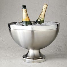 two bottles of champagne in a silver bowl